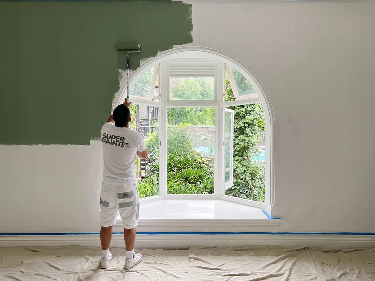 Super Painter applying a premium paint finish